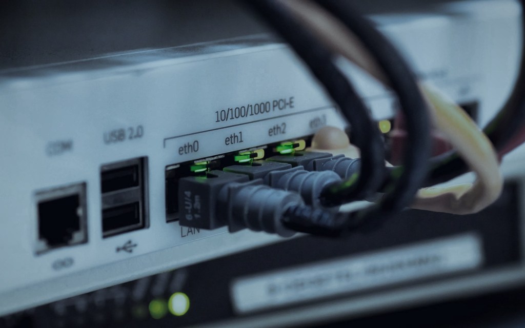 Router appliance with connected Ethernet cables and link lights